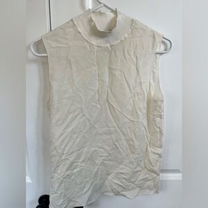 White flows turtleneck tank top